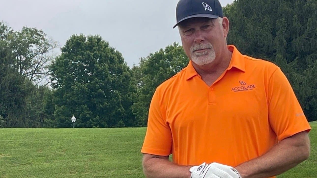 Scott at Hot August Cyber Cup golf tournament with Accolade Technologies sign